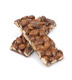Barrette di croccantino da 1.5 kg, croccanti e ricche di nocciole, ideali per snack e preparazioni dolci in pasticceria