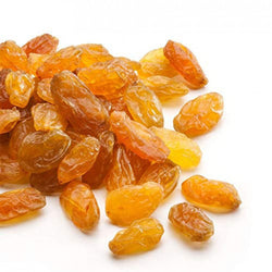 Uva sultanina australiana Serfruit Extra Quality in una ciotola accanto a un panettone artigianale